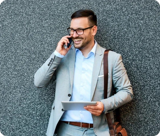 RSA Premium Support Benefits. A photo of a man in a suit, leaning against a wall talking on a phone